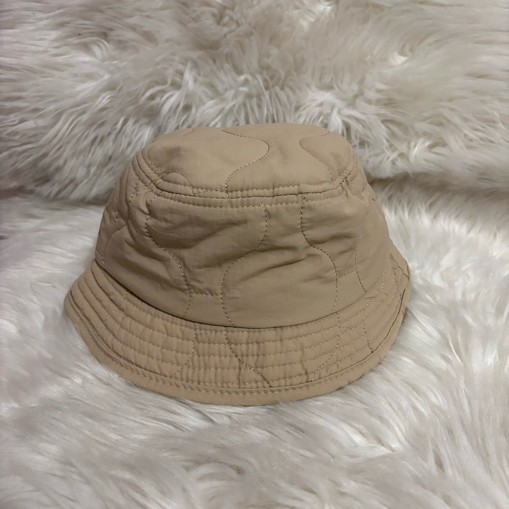 Urban Outfitters | nude quilted nylon bucket hat